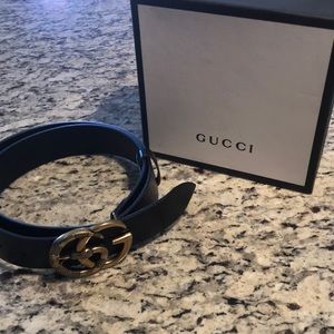 Double G snake Gucci belt.